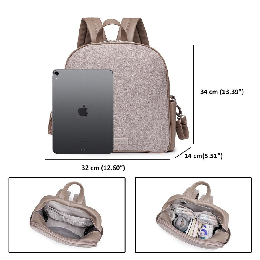 Beige vegan leather diaper bag backpack with multiple compartments and adjustable straps shown with tablet for size reference