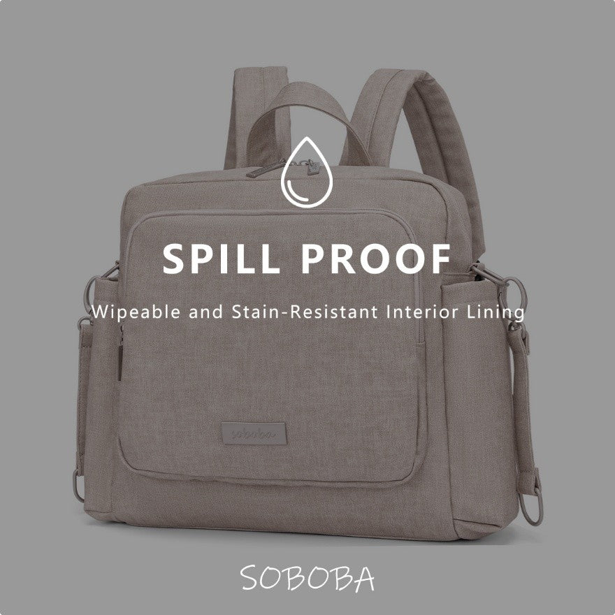 Spill proof vegan leather diaper bag backpack with wipeable and stain-resistant interior lining in gray